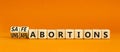 Safe or unsfe abortions symbol. Concept words Safe abortions and Unsfe abortions on wooden cubes. Beautiful orange table orange Royalty Free Stock Photo