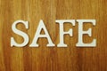 Safe word alphabet letters on wooden background