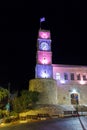 Night view of the clock tower of Wolfson Community Center building in a square in the old city of Safed in northern Israel Royalty Free Stock Photo