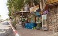 Street stall with drinks and small sweets, decoratively decorated with old household items in the Safed city old part of in