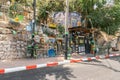 Street stall with drinks and small sweets, decoratively decorated with old household items in the Safed city old part of in