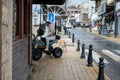 SAFED, ISRAEL - MARCH 25, 2022: Girl in a white jacket on a quad bike on the street