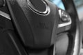 Safety airbag sign on steering wheel inside car, closeup Royalty Free Stock Photo