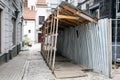 Safety aisle during house reconstruction for pedestrians. Small street