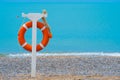 Safety vacation beach sea lifebuoy resort concept swimming safe rescue, concept red buoy from lifesaver from seascape Royalty Free Stock Photo