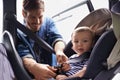 Safety, car seat and belt with father with baby for transportation, security and drive. Travel, protection and caution