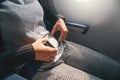 Safety concept Asian Woman is Fastening Seat belt on Airplane Ready to Take off Royalty Free Stock Photo