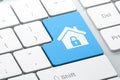 Safety concept: Home on computer keyboard background Royalty Free Stock Photo