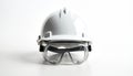 Safety concept. White hard hat rests with goggles on bright background. Protective gear for workplace construction worker. Royalty Free Stock Photo