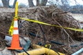 Safety cone and caution tape by beach erosion