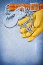 Safety construction body belt leather protective gloves on scrat