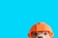 Safety, construction, DIY concept - cute dog in hard hat on color background Royalty Free Stock Photo