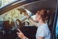 Safety driving woman adjust the car rearview mirror Royalty Free Stock Photo