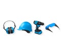 Safety earmuffs, hard hat, cordless drill, and safety goggles isolated on white background with clipping path, construction safety Royalty Free Stock Photo