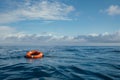 Safety equipment. Life buoy or rescue buoy floating on sea to rescue people. Generative AI Royalty Free Stock Photo