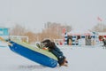 Safety equipment on slides. The child falls from the sled. Fall of children. Safety rules for winter slides. injuries in winter. Royalty Free Stock Photo