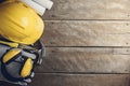 Safety equipment and tool kit on wooden background Royalty Free Stock Photo