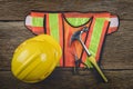 Safety equipment and tool kit on wooden background Royalty Free Stock Photo