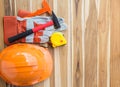 Safety equipment and tool kit on wooden table background Royalty Free Stock Photo