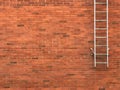 Safety exit ladders on brick wall building