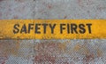 Safety First Sign on caution strip Royalty Free Stock Photo