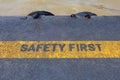 Safety First Sign on caution strip Royalty Free Stock Photo
