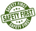safety first stamp. safety first label. round grunge sign Royalty Free Stock Photo