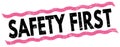 SAFETY FIRST text on pink-black lines stamp sign Royalty Free Stock Photo