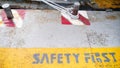 Safety first yellow label floor sign symbol on grey metal texture