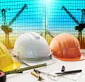 Safety helmet on architect ,engineer working table with modern b Royalty Free Stock Photo