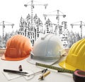 Safety helmet on architect ,engineer working table with modern b Royalty Free Stock Photo