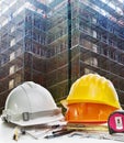 Safety helmet and engineering working tool against building cons Royalty Free Stock Photo