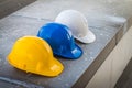 The safety helmet put on the blueprint at construction site Royalty Free Stock Photo