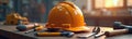Safety helmet sits on workbench surrounded by tools. Workplace safety concept. Image emphasizes importance of precaution, Royalty Free Stock Photo