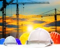 Safety helmet and structure of high crane in construction site a Royalty Free Stock Photo