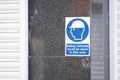 Safety helmets must be worn sign on construction building site