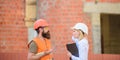 Safety inspector concept. Construction site safety inspection. Discuss progress project. Woman inspector and bearded Royalty Free Stock Photo