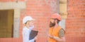 Safety inspector concept. Construction site safety inspection. Discuss progress project. Woman inspector and bearded Royalty Free Stock Photo