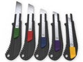 Safety knives with snap different coloured retract buttons Royalty Free Stock Photo