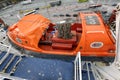 Safety lifeboat hanging on a hook on a deck of a cruise ferry ship. Stockholm, Sweden