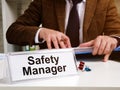 Safety manager works with instructions of OSHA Occupational Safety and Health Administration