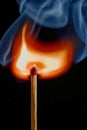 Safety match on black background with flaming head Royalty Free Stock Photo