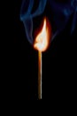 Safety match on black background with flaming head Royalty Free Stock Photo