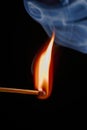 Safety match on black background with flaming head Royalty Free Stock Photo