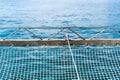 Safety net on a boat or yacht against the background of the blue sea Royalty Free Stock Photo