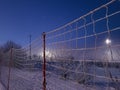 Safety net on a red stick against the background of the night sky and lanterns Royalty Free Stock Photo