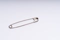 Safety pin on white background Royalty Free Stock Photo