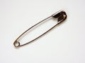 Safety pin on white background Royalty Free Stock Photo