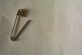 Safety pin on a white paper background Royalty Free Stock Photo