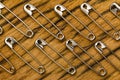 Safety pins background on wood Royalty Free Stock Photo
